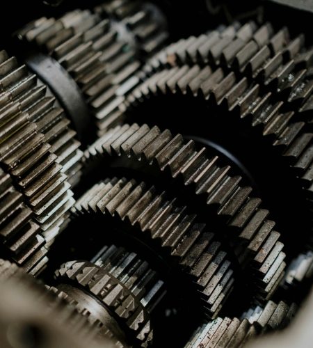 Detailed close-up of metal gears inside a machine showcasing precision engineering.